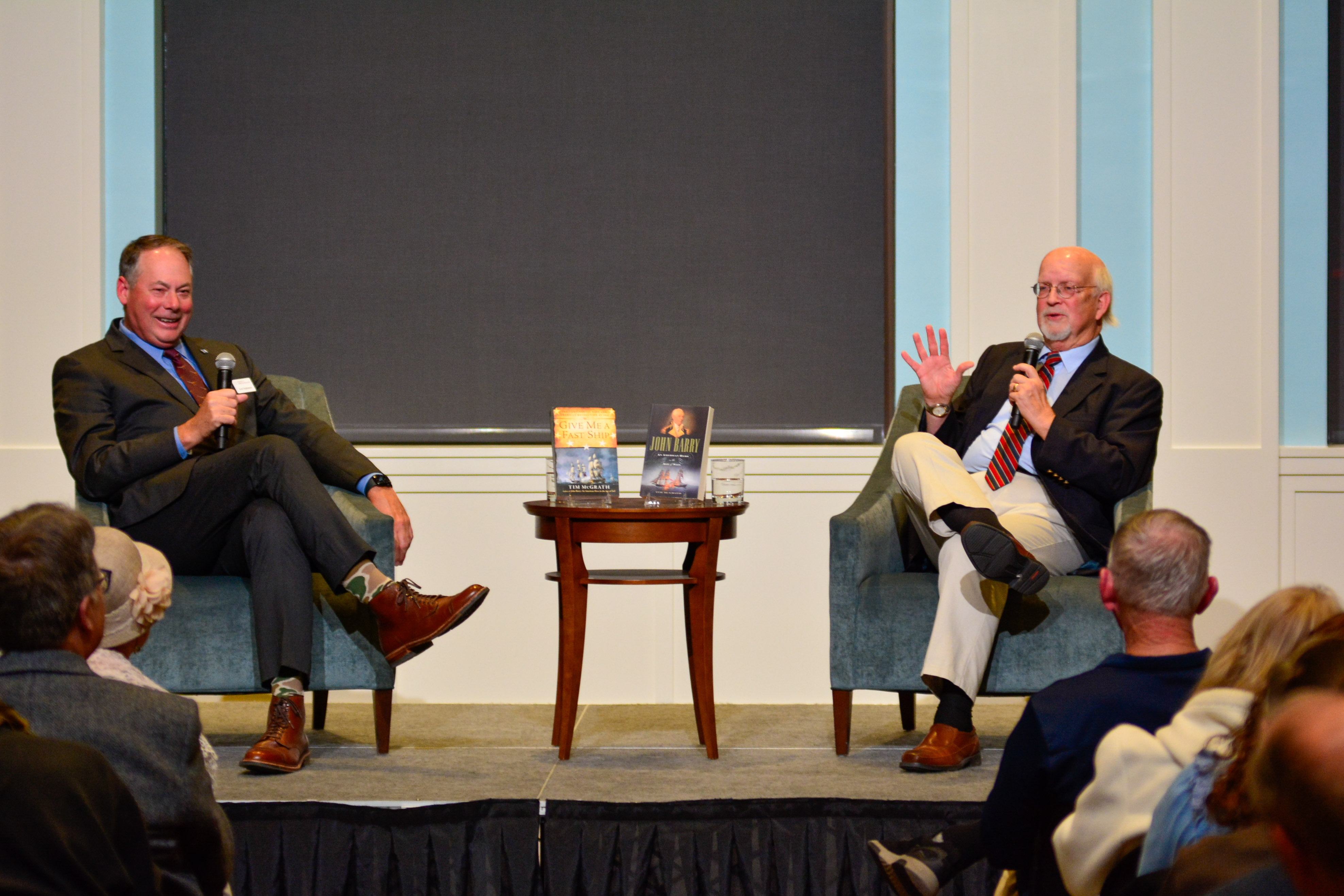 Tim McGrath and Dr. R. Scott Stephenson on stage talking to the audience in Liberty Hall as part of the Museum's Read the Revolution Speaker Series.