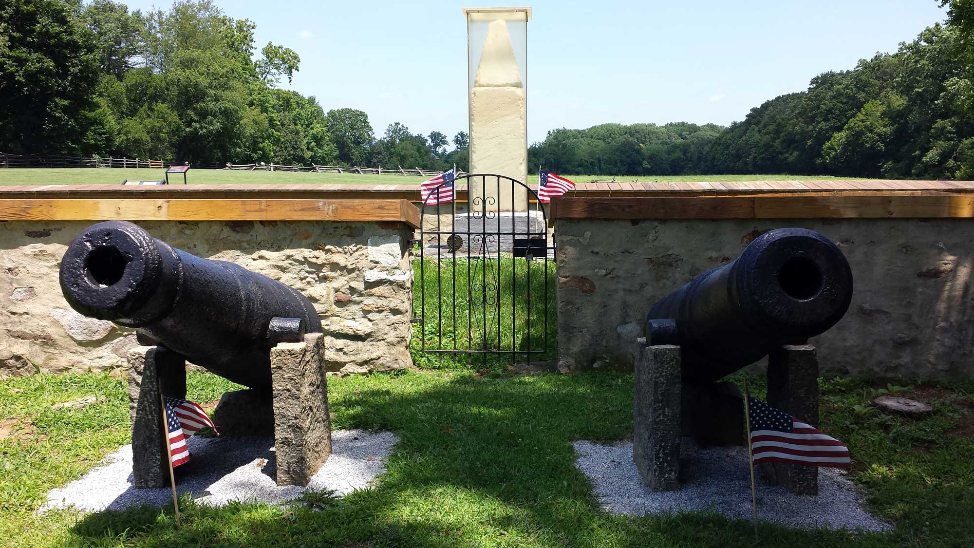 This image is of the Paoli Battlefield monument between two cannon at Paoli Battlefield.