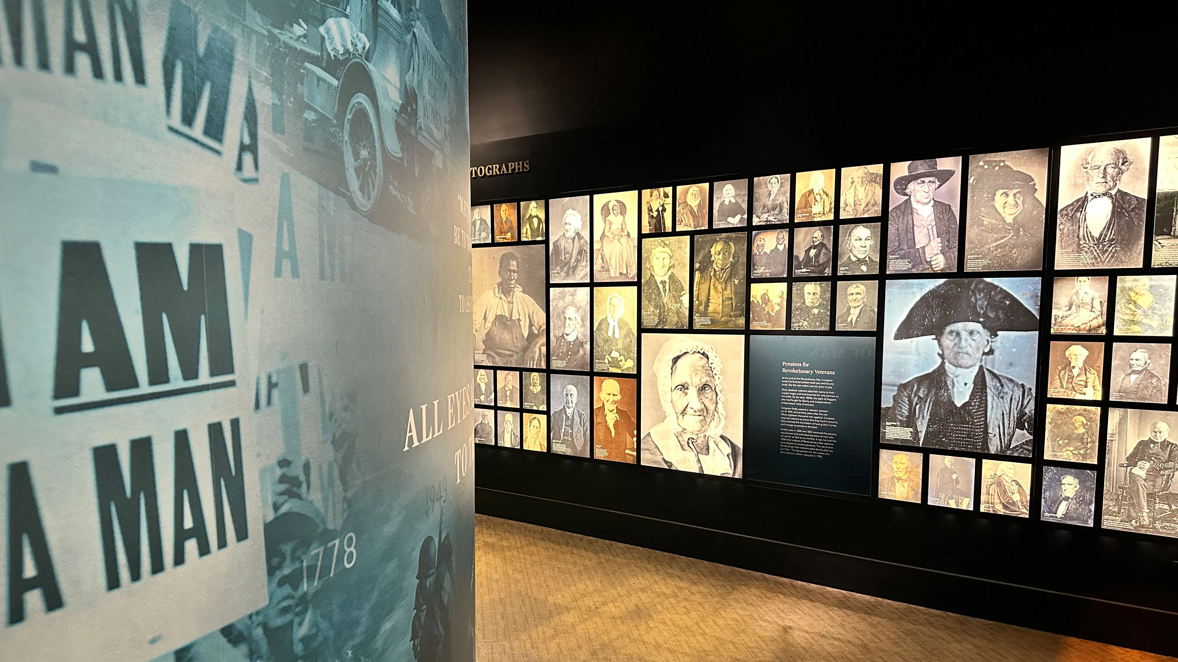 Inside of the Revolutionary Generation gallery in the Museum of the American Revolution featuring photographs of the revolutionary generation