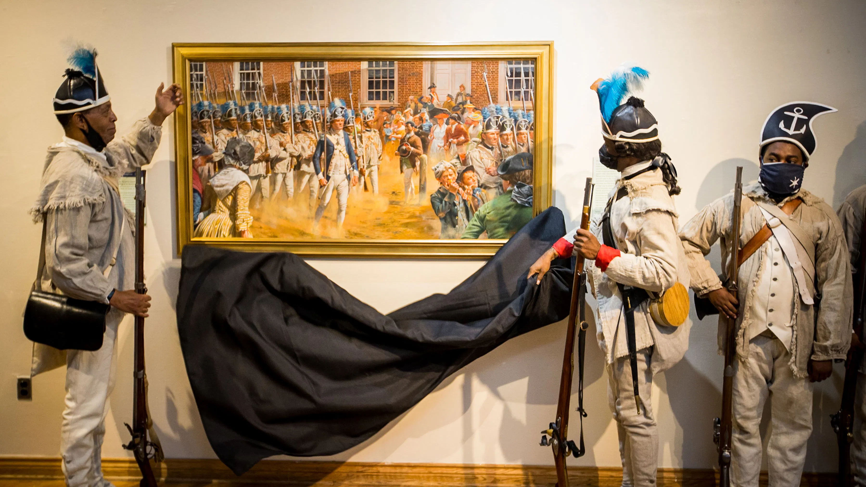 Members of the First Rhode Island Regiment of Foot living history group unveil "Brave Men as Ever Fought" painting.