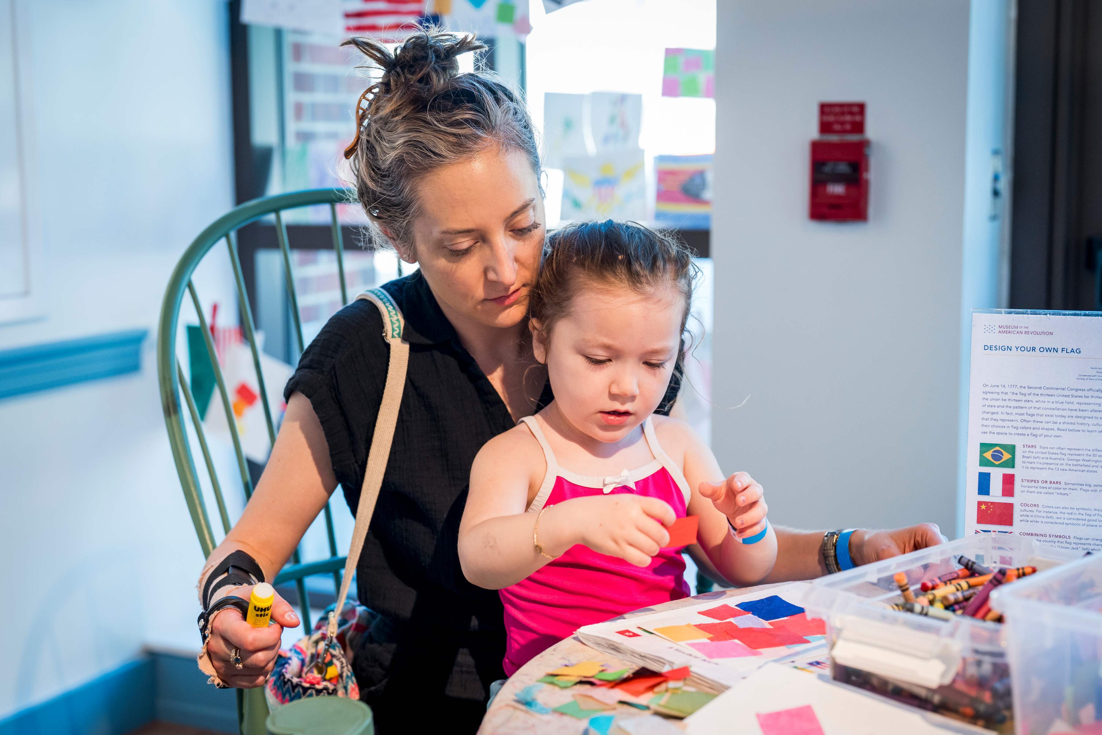 A woman and a child do a craft project