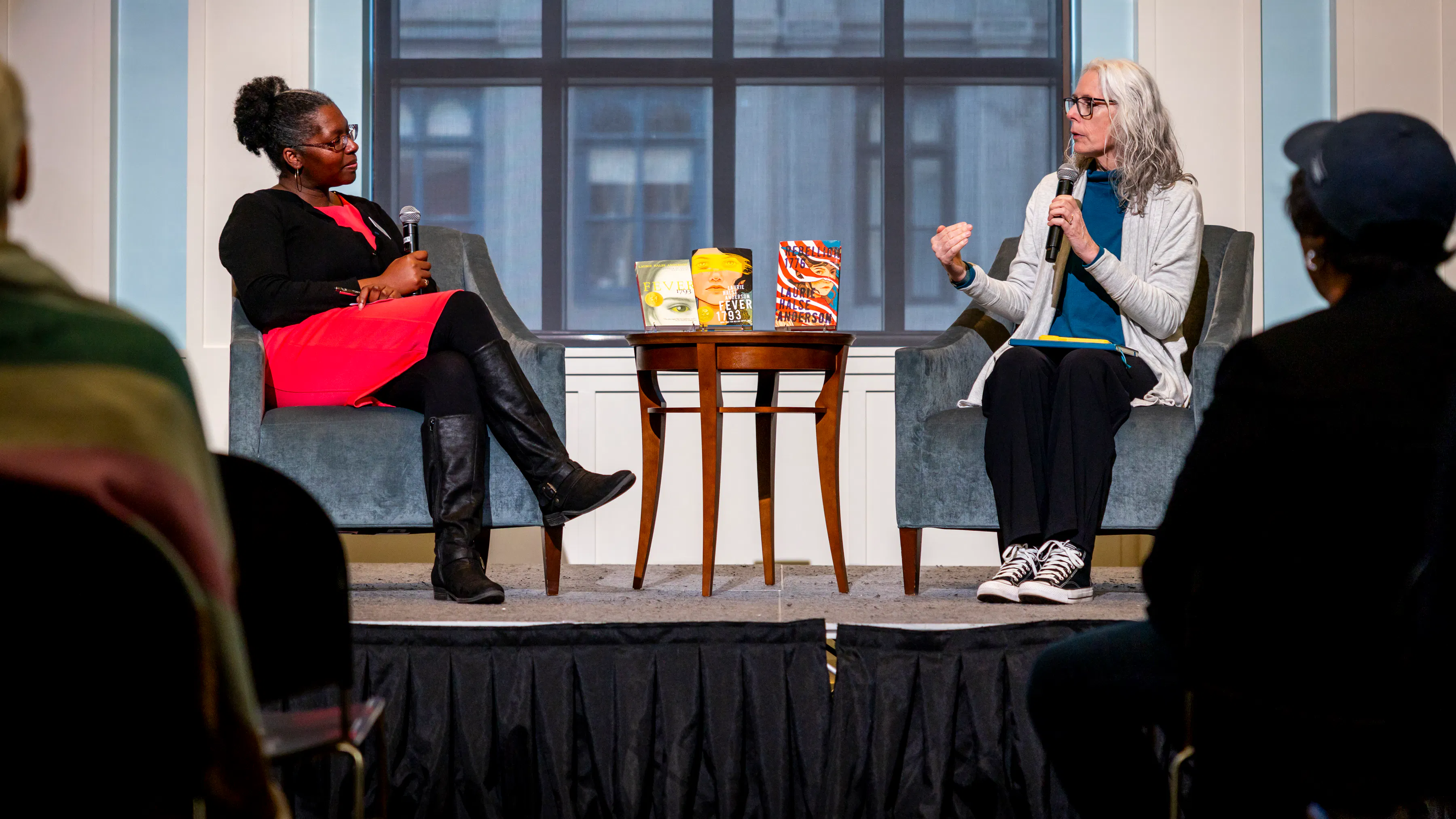 Director of Education and Community Engagement Adrienne G. Whaley and author Laurie Halse Anderson onstage