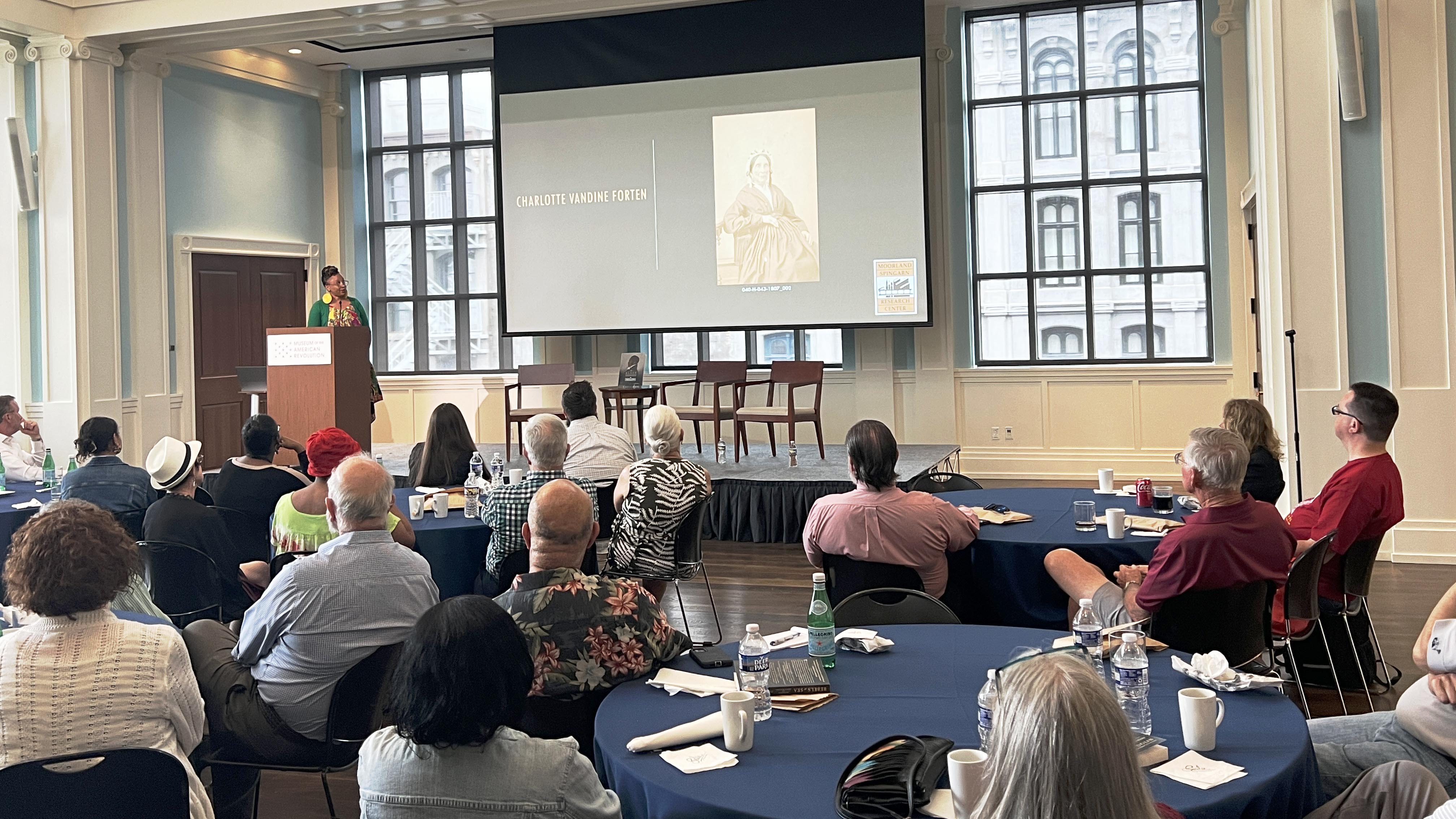 Lela Sewell-Williams presents about Charlotte Vandine Forten at a Members Lunch and Learn event.