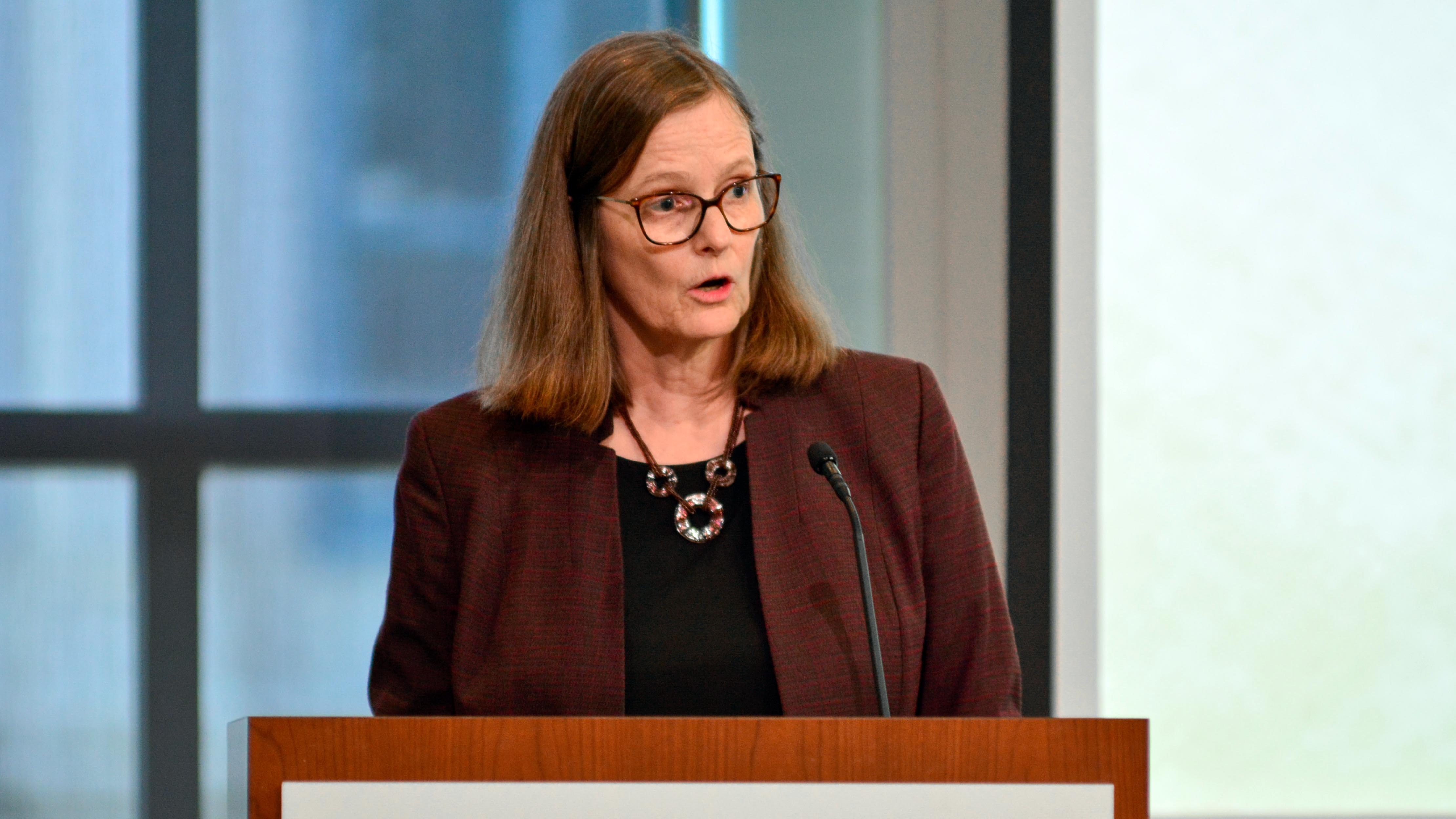 Friederike Baer presents from a podium about her book Hessians as part of the Museum's Read the Revolution Speaker Series.
