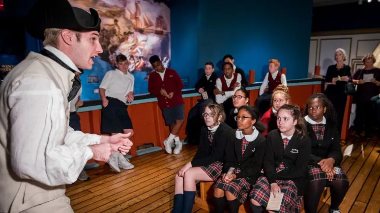 Schoolchildren at a museum exhibit