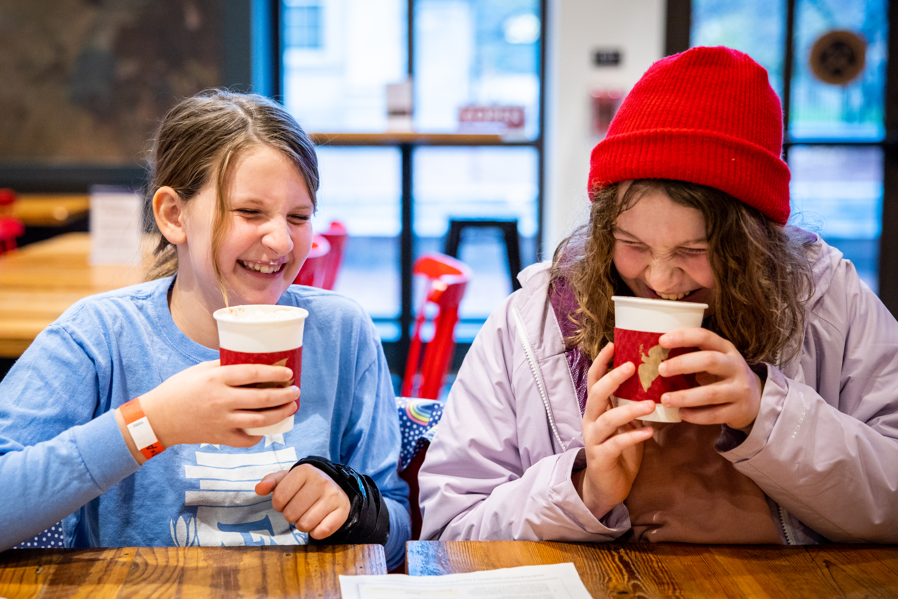 Two young visitors sip hot chocolate in the Museum's Cross Keys Cafe.