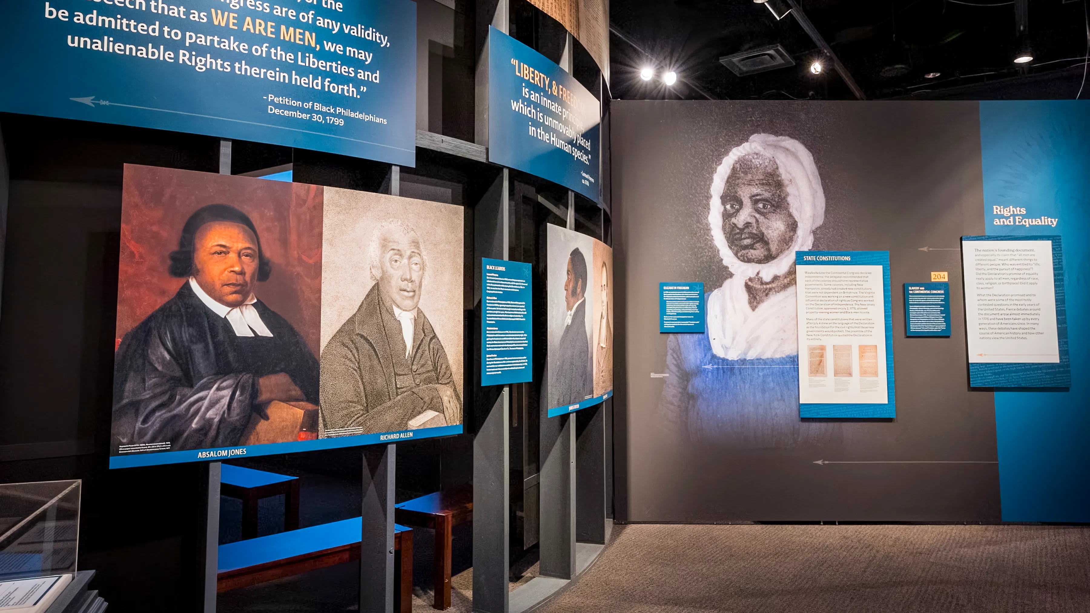 Museum exhibition wall featuring prominent Black Revolutionary era figures.