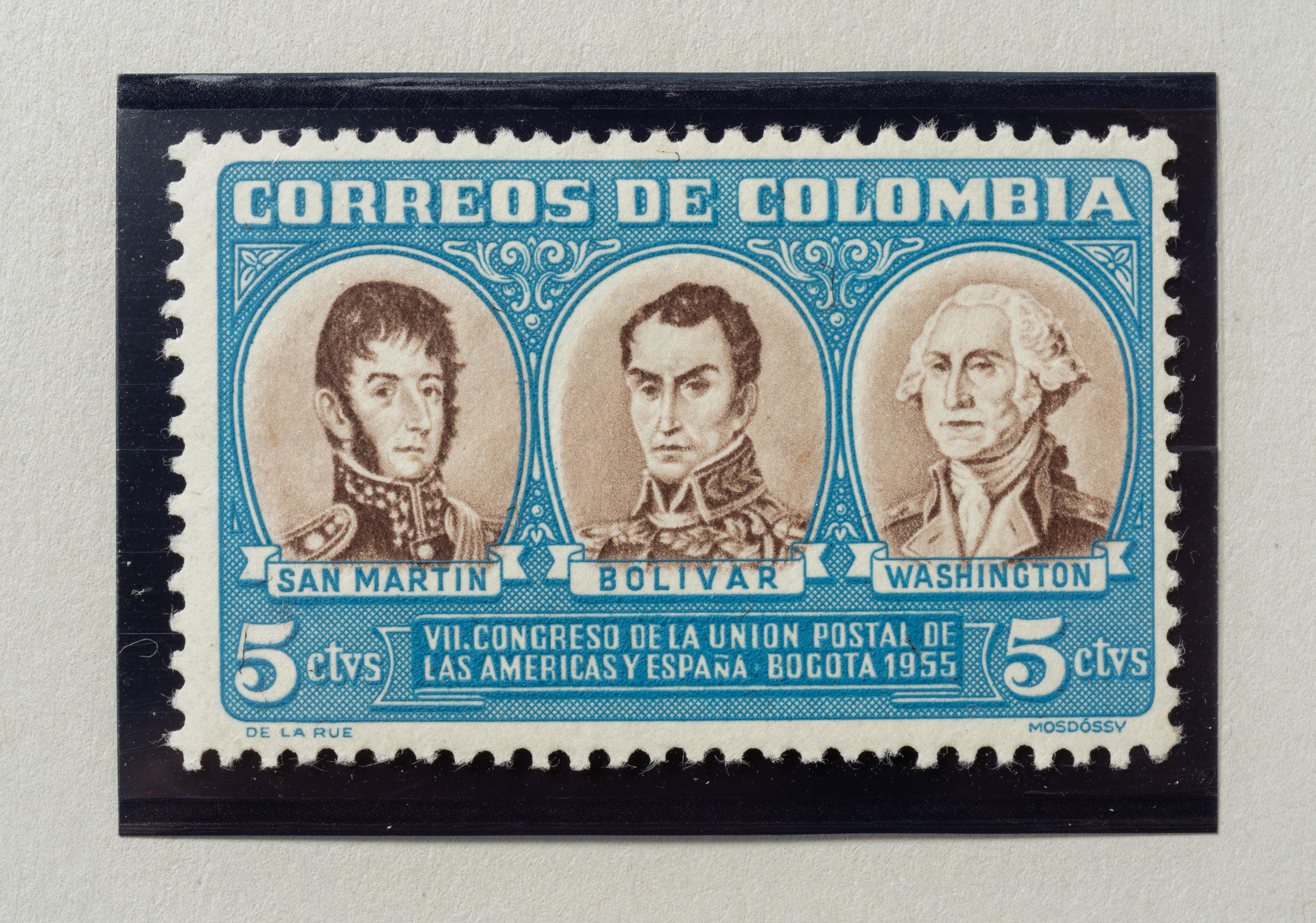 A blue and white postage stamp with the likenesses of General George Washington, José Francisco de San Martín, and Simón Bolívar.