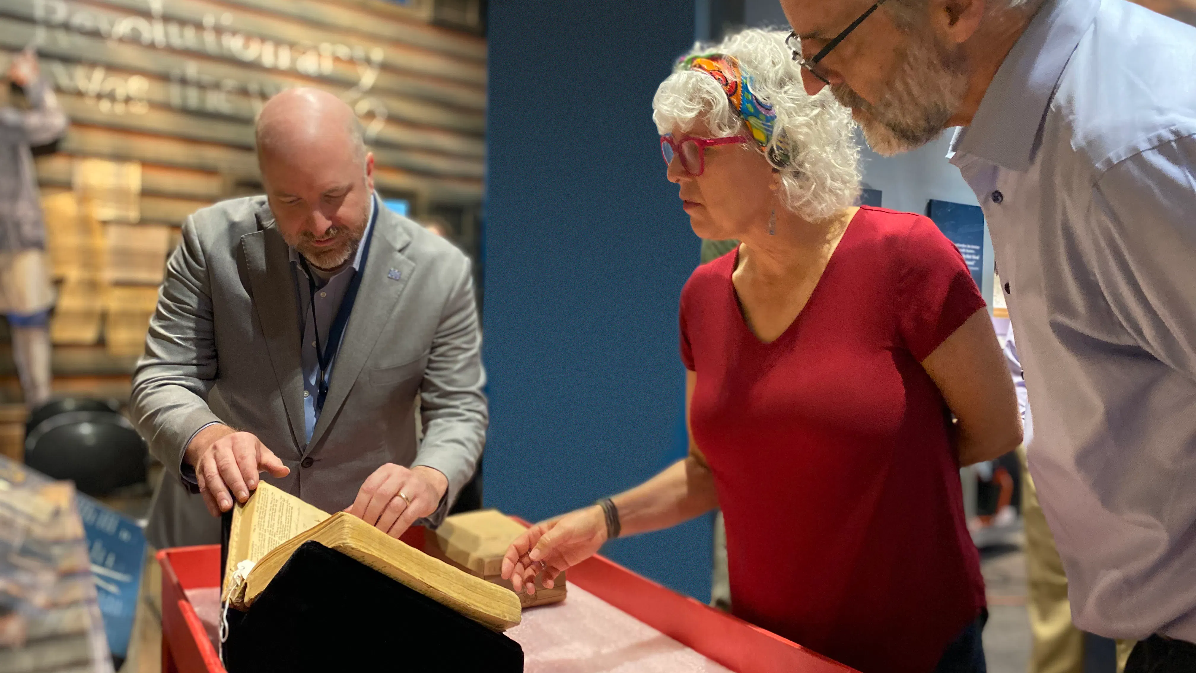 L R Dr Philip Mead Aileen Edge And David Edge Examine The Claypoole Bible Credit Moar 