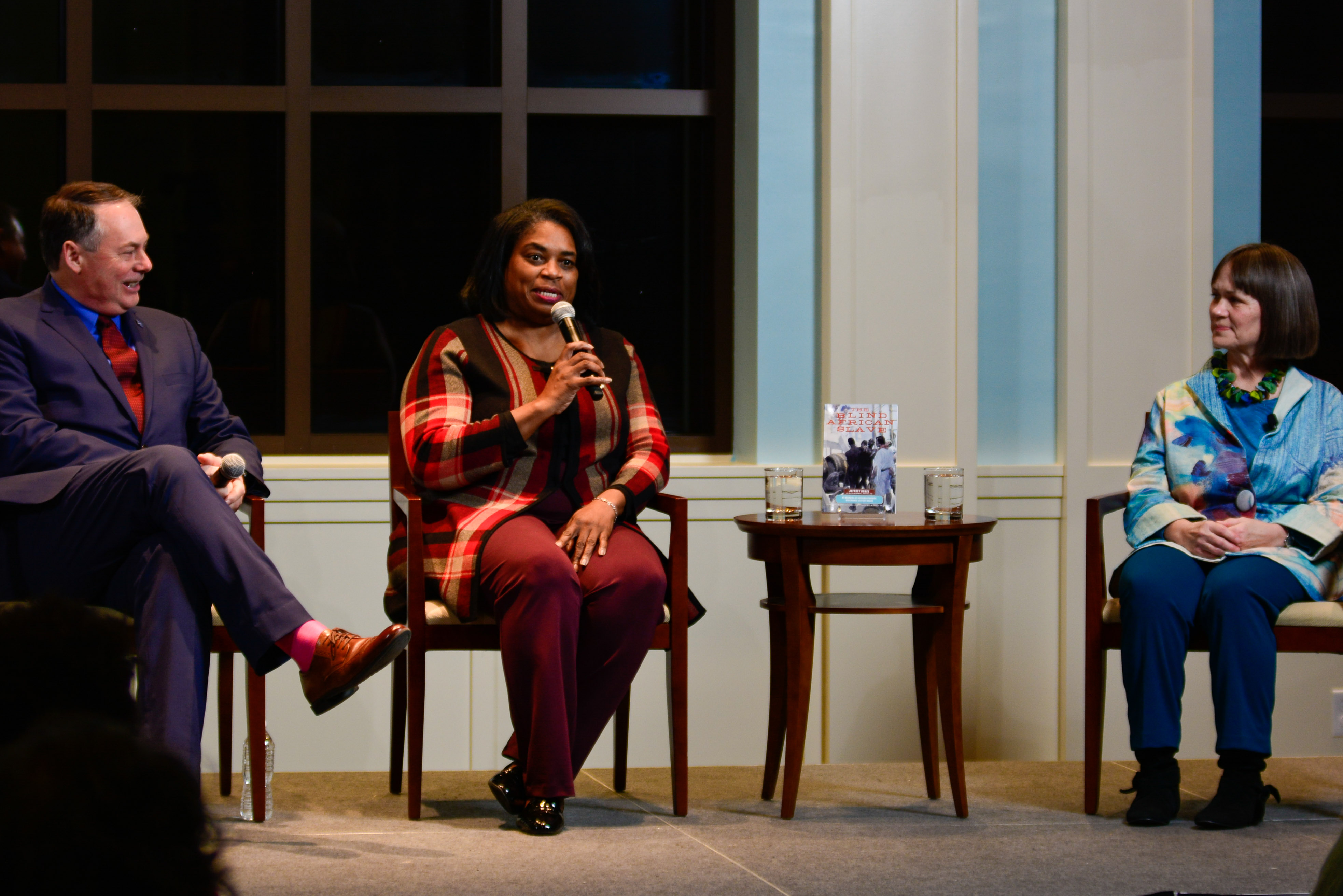 President & CEO Dr. R. Scott Stephenson (left) leads a question and answer session with Rhonda Brace (center, speaking) and scholar Kari Winter.