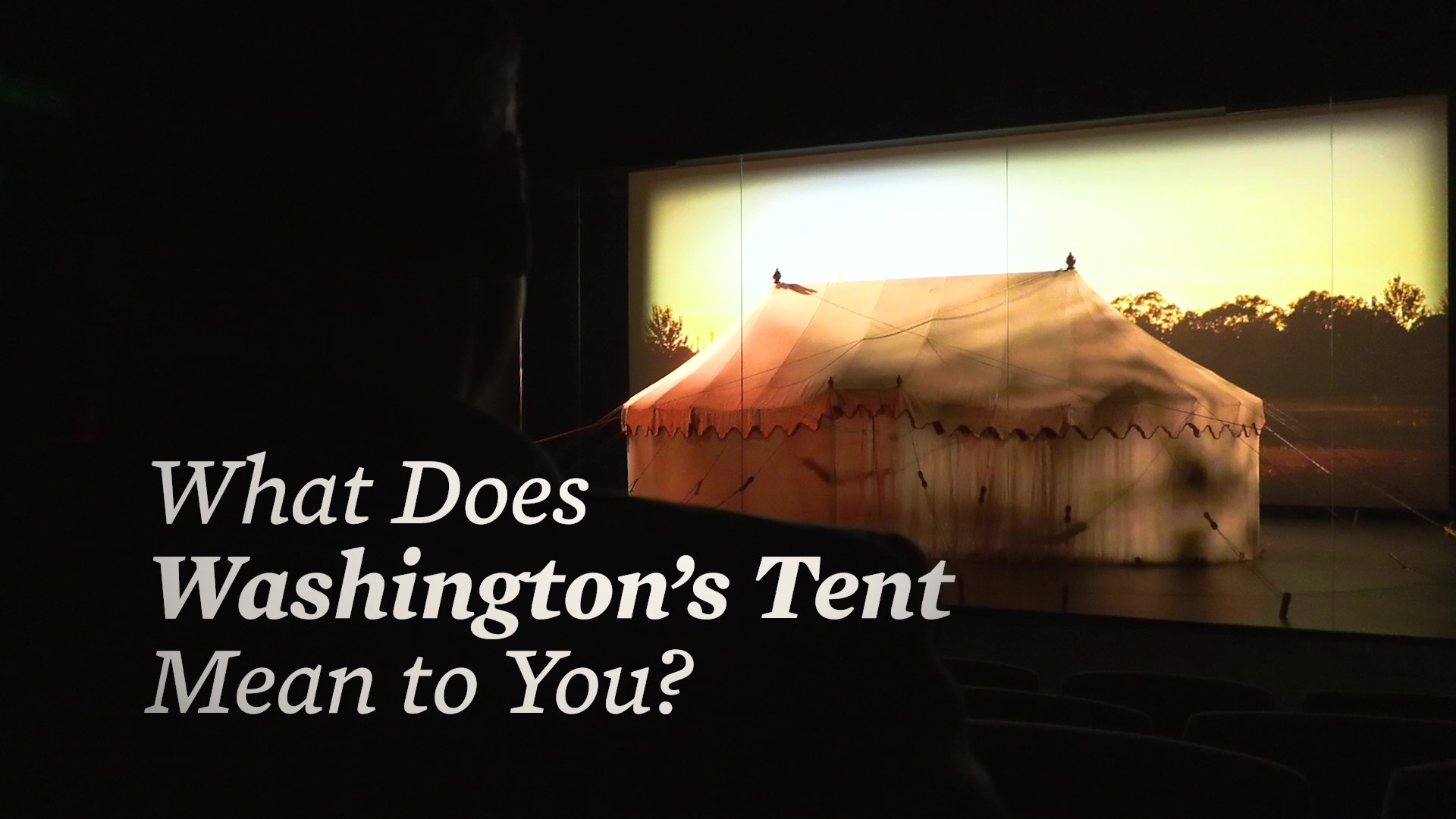This image shows George Washington's tent with an orange lighting with the words what does washington's tent mean to you across the screen.