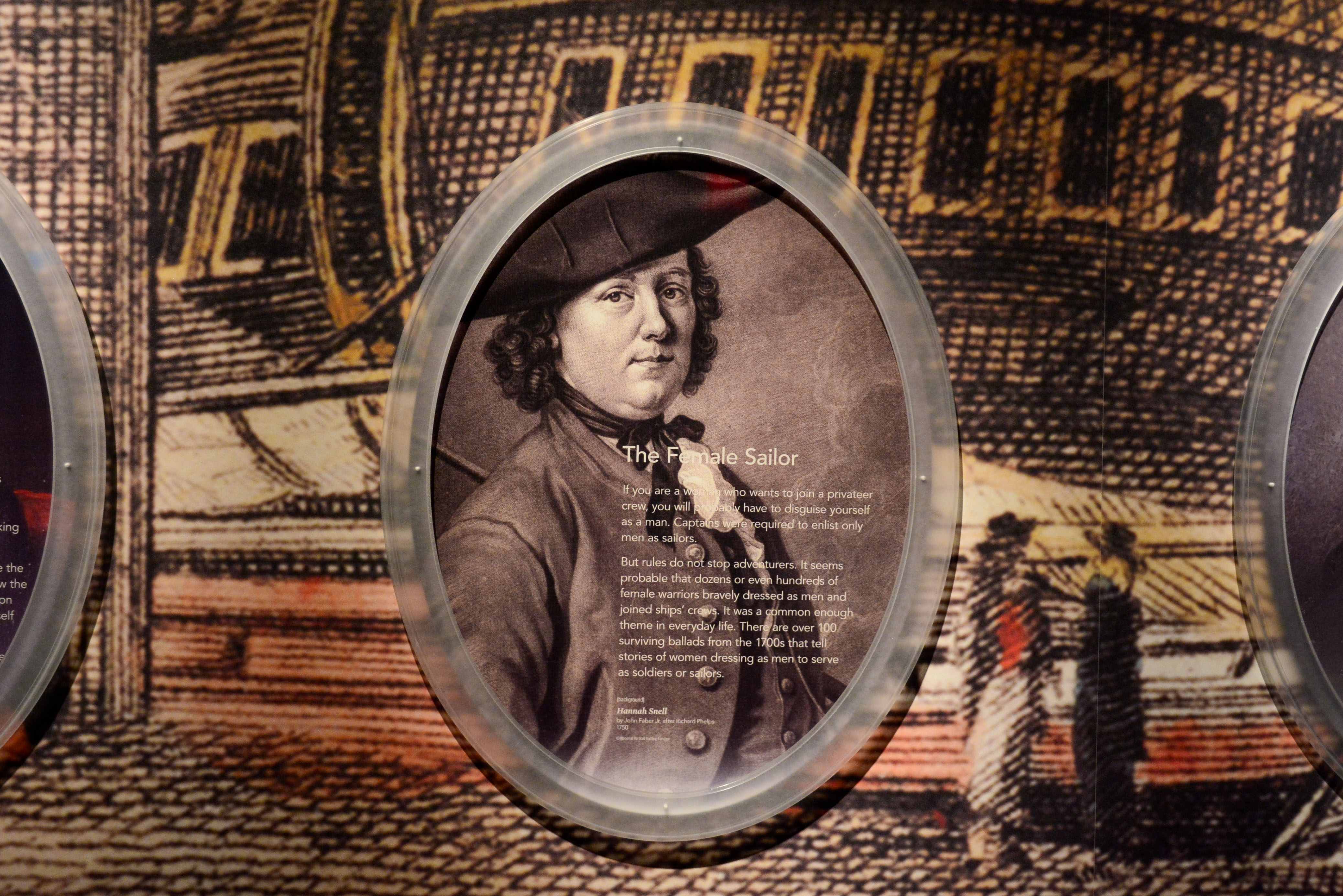 A reproduction of a portrait of female sailor Hannah Snell is the focus of a wall graphic about women at sea during the Revolutionary War.
