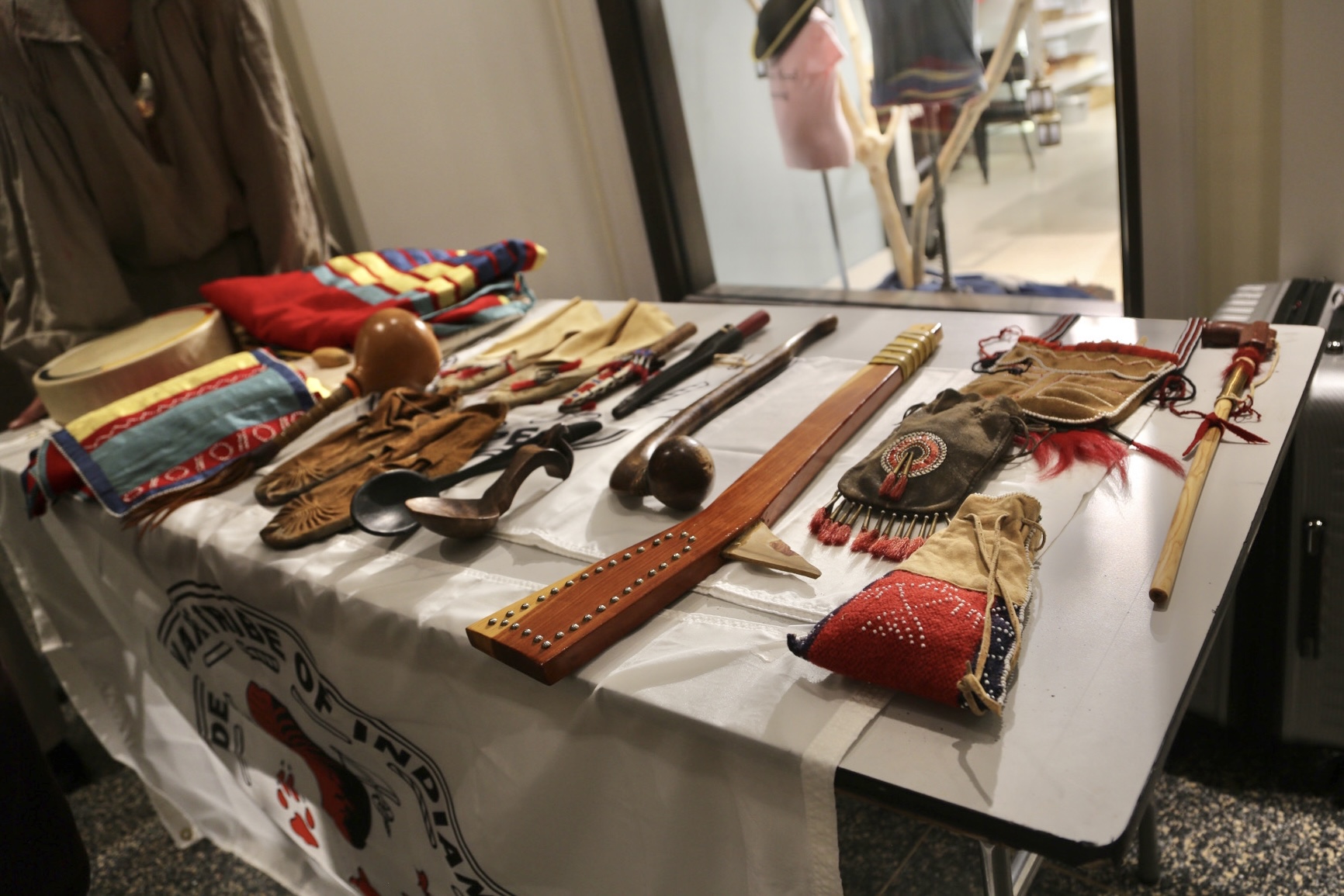Cultural objects displayed on a table by representatives from the Delaware Tribe of Indians.