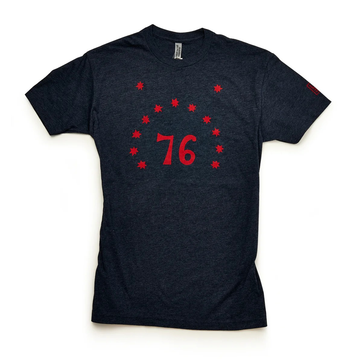 A black T-shirt with the number 76 in red surrounded by an arc of red stars and two red stars above