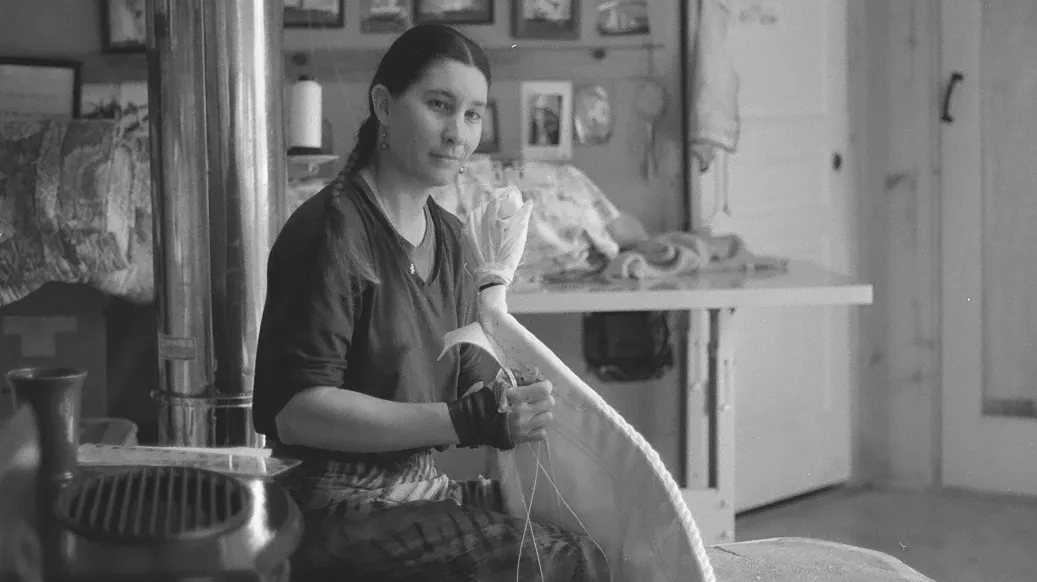 Force10 Sailmaking's Nahja Chimenti works on a sail in the family business's workshop.