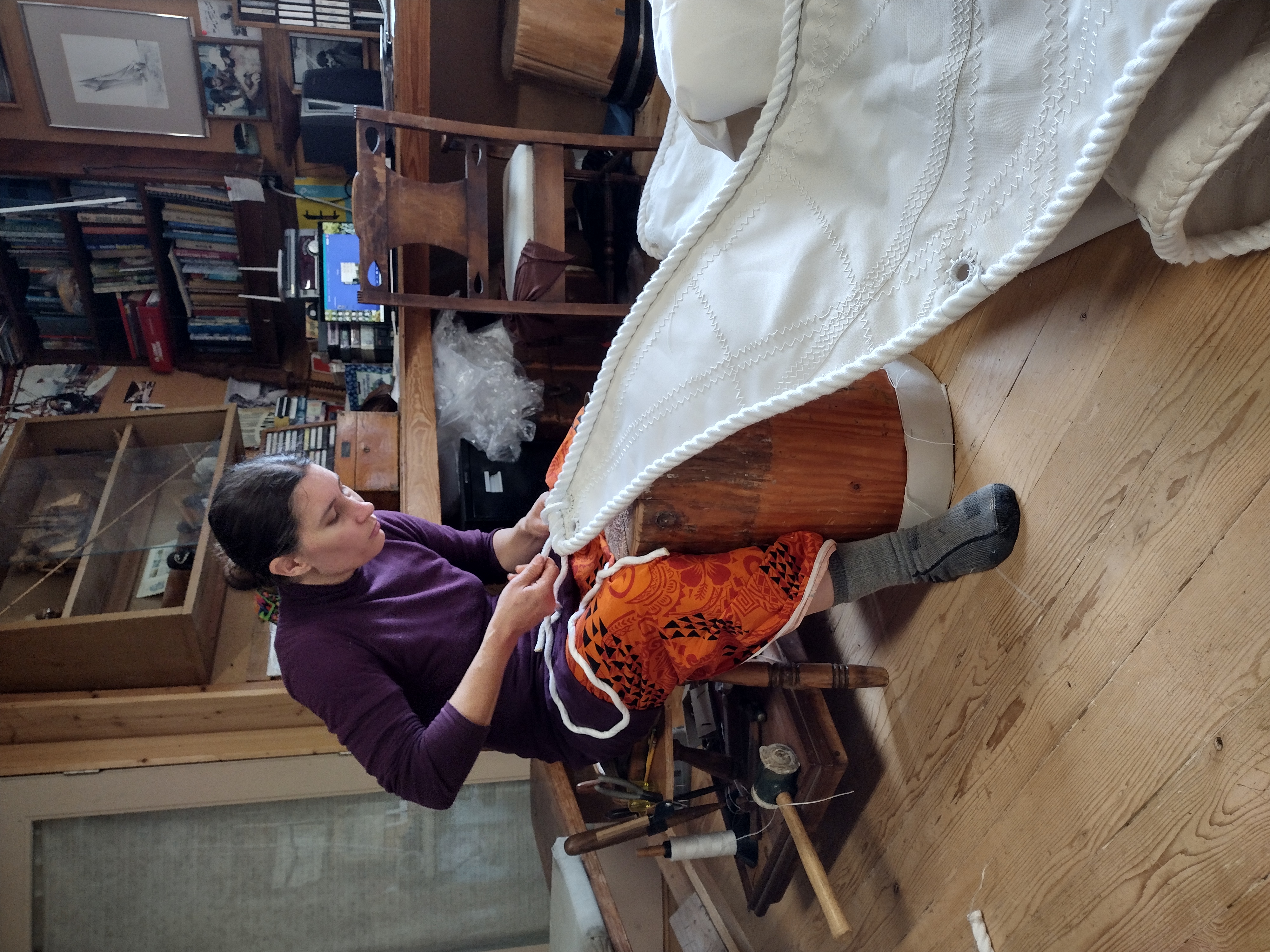 Force10 Sailmaking's Nahja Chimenti works on a sail in the family business's workshop.