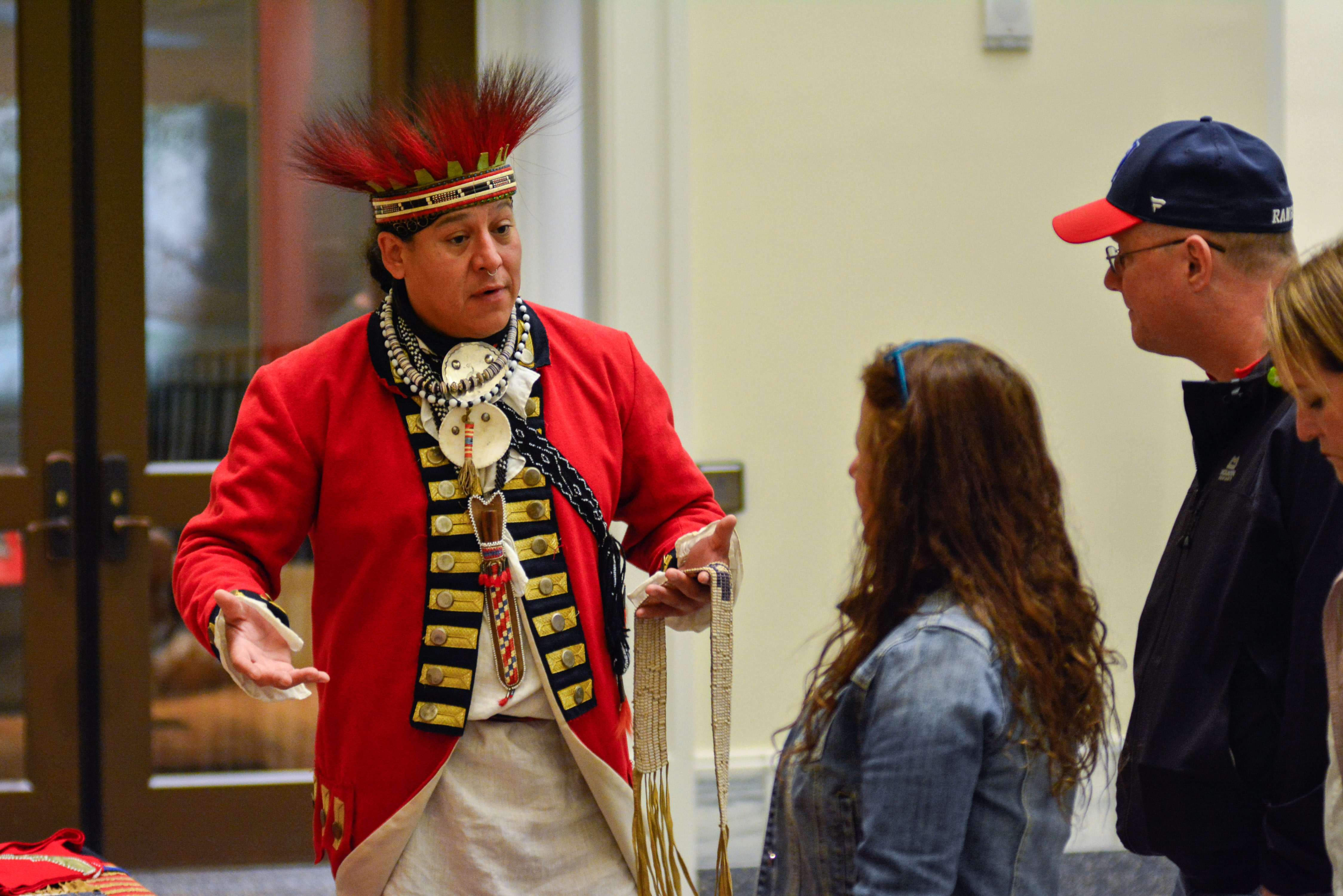 Jordan Smith dresses in traditional Mohawk clothing at the Museum as part of Indigenous Peoples Weekend in 2022.