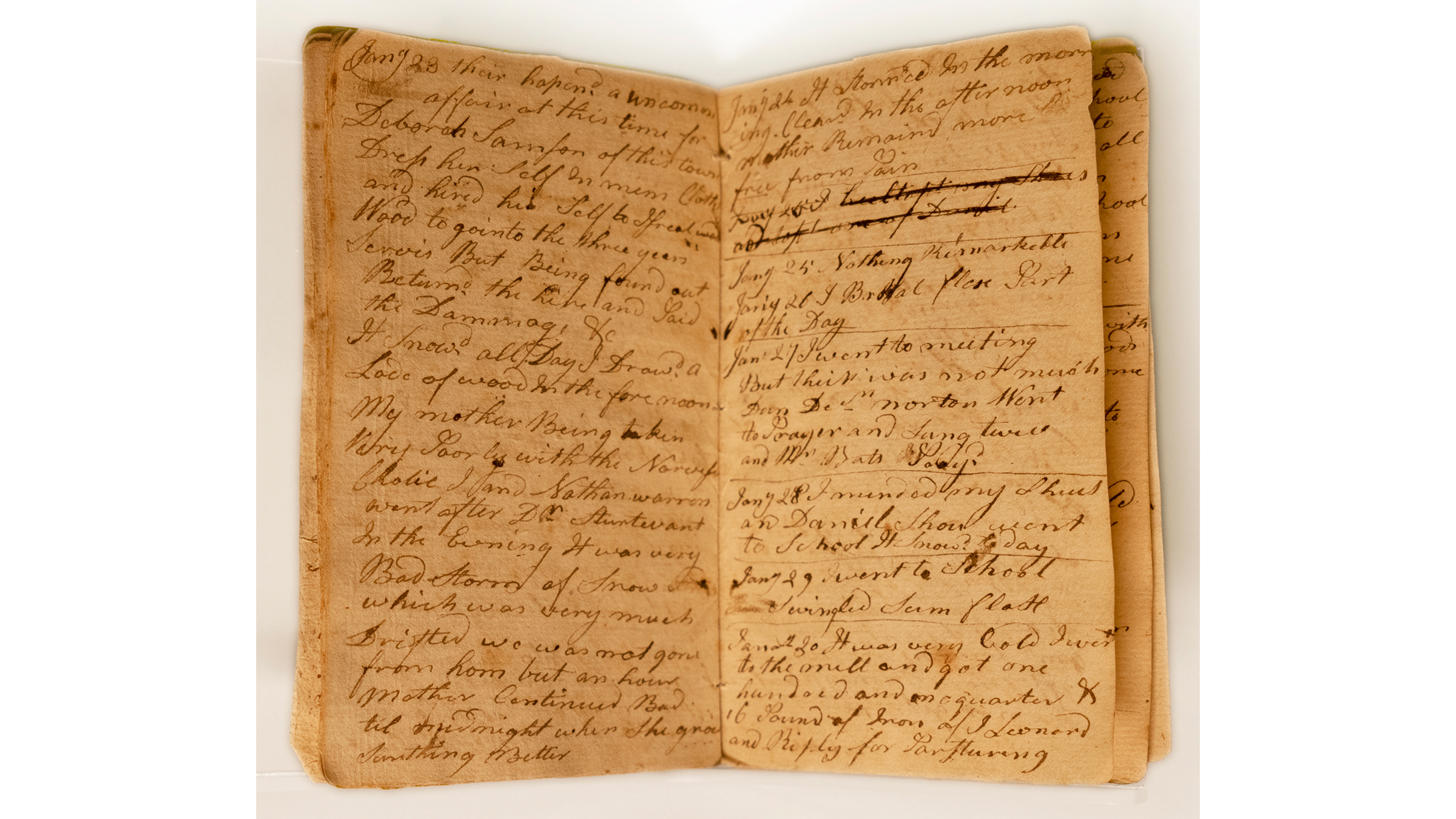 Small book opened to show two pages filled with short, handwritten notes
