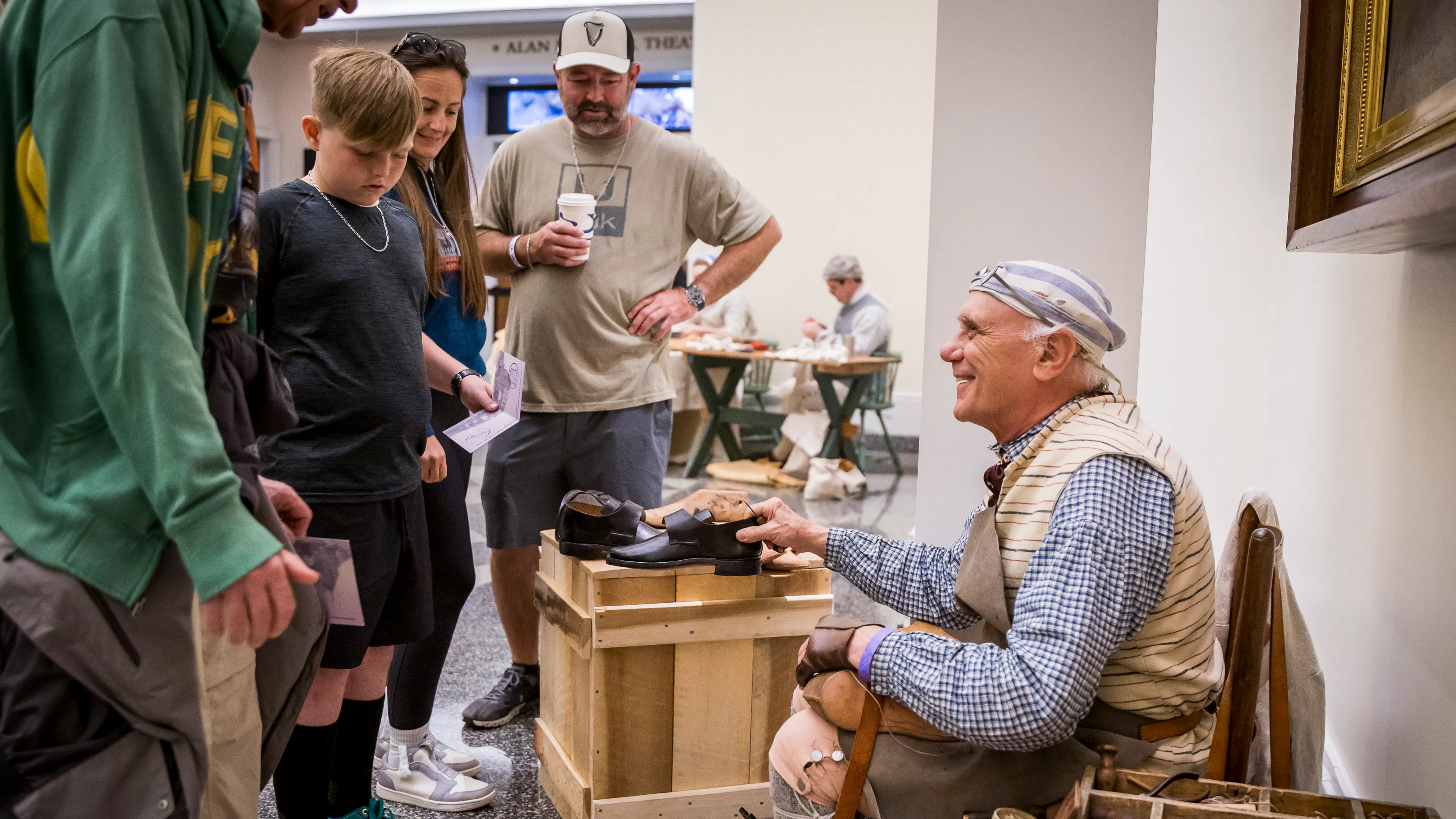 A costumed interpreter interacts with guests