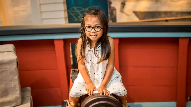 Girl at an interactive exhibit