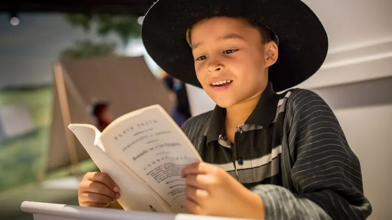 Kid at a museum exhibit