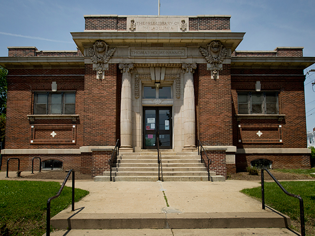 The brick and stone facade of the Holmesburg branch library in Philadelphia.